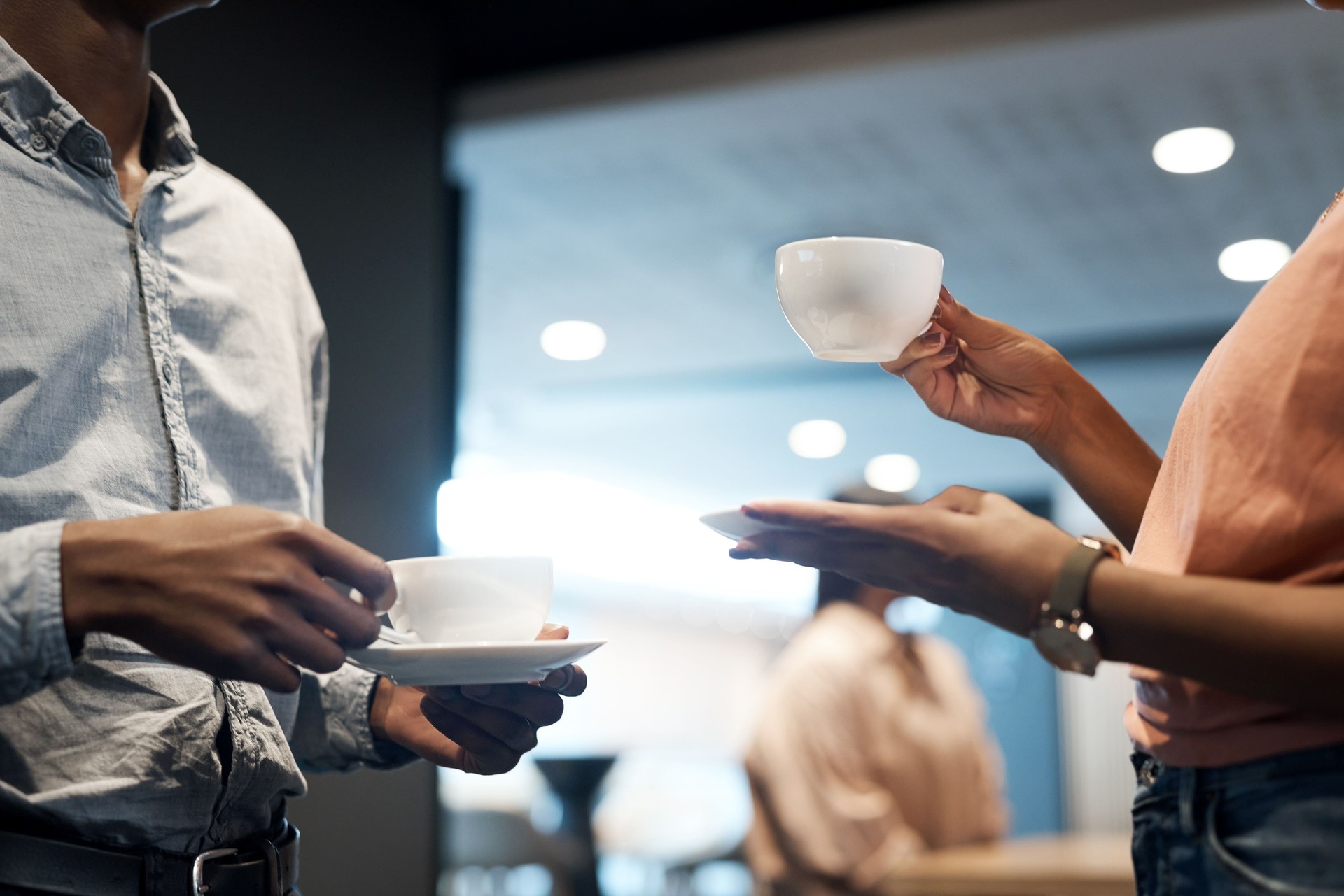 Shot of two unrecognisable businesspeople having coffee at a conference