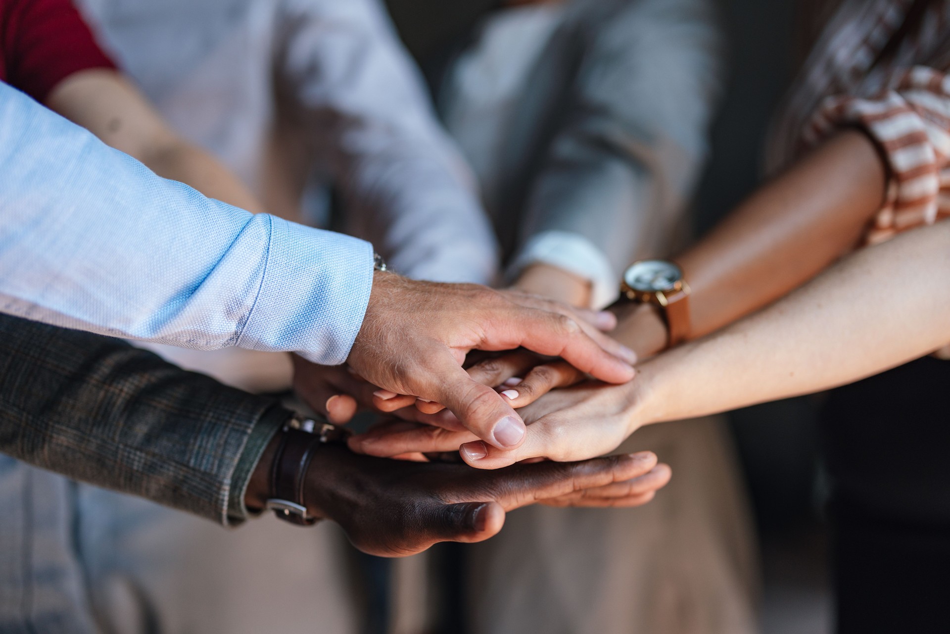 Diverse Business Team Joining Hands in Unity