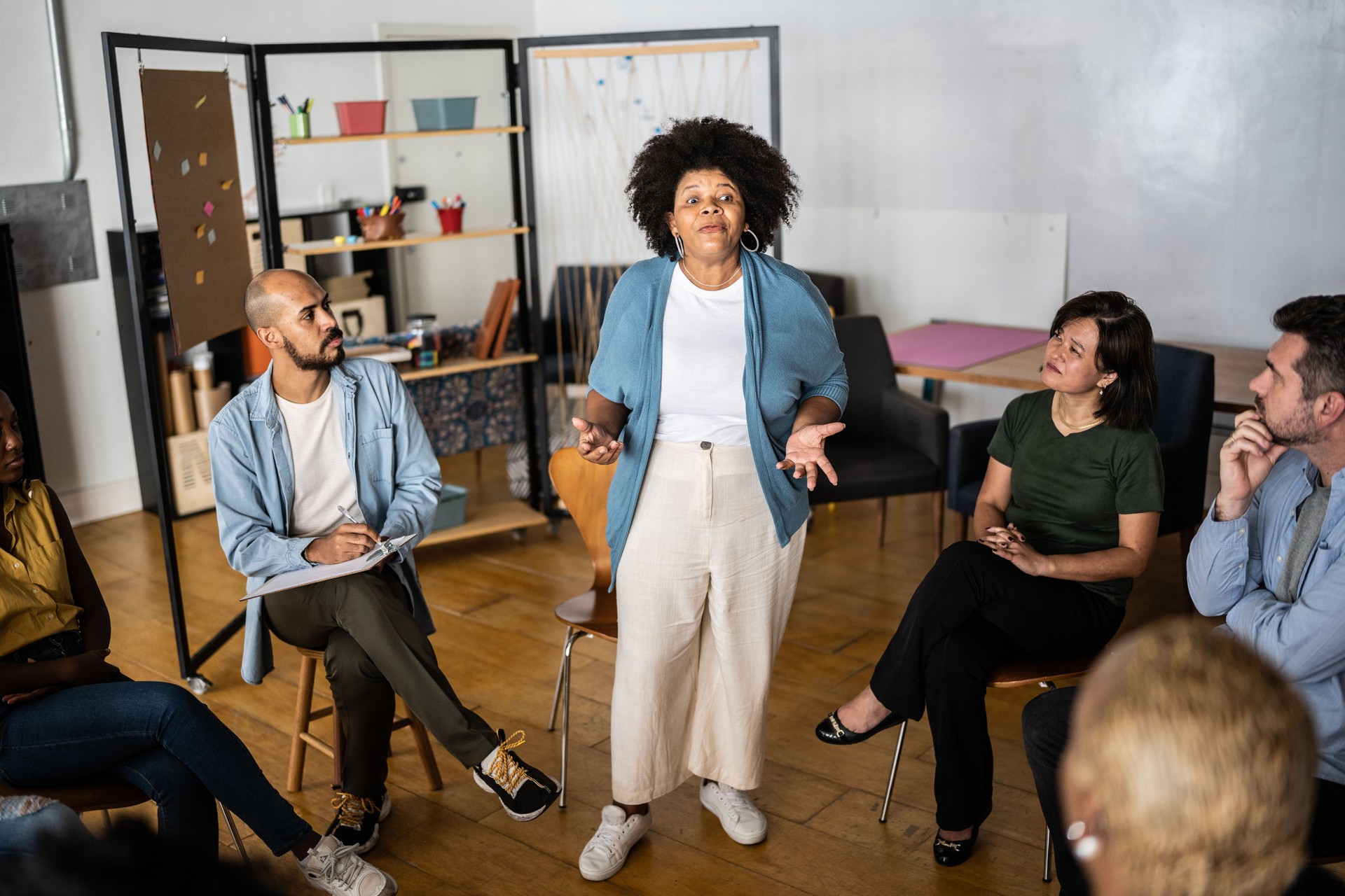 Mature woman talking in a meeting or group therapy